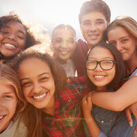 Teenage,School,Friends,Smiling,To,Camera,,Close,Up