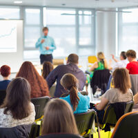 31763231 - speaker at business workshop and presentation with audience at the conference room.