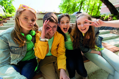 friendship and people concept - happy teenage friends or high school students having fun and making faces